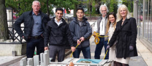 Gail Spreen with a group of people and a 3D model of Streeterville