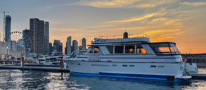 The private charter yacht Gypsy Spirit docked at Navy Pier Marina with a beautiful sunset behind her.