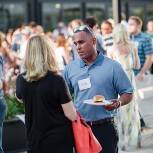 2 people talking at a networking event