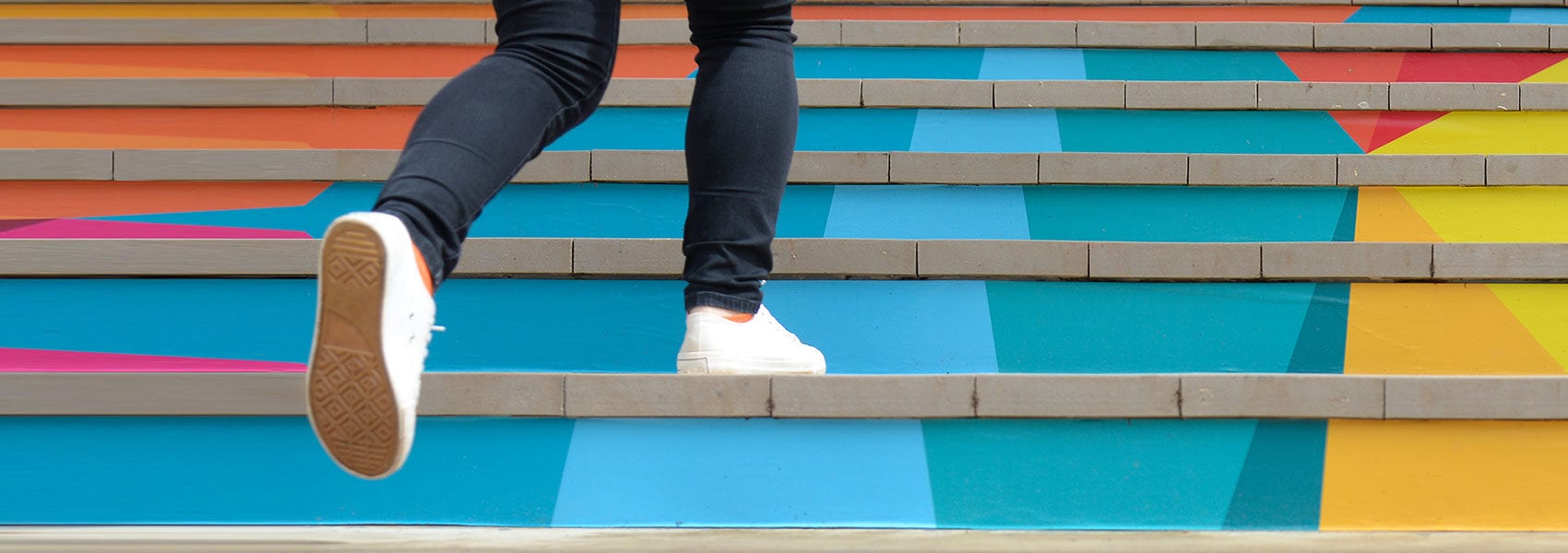 woman running up stairs